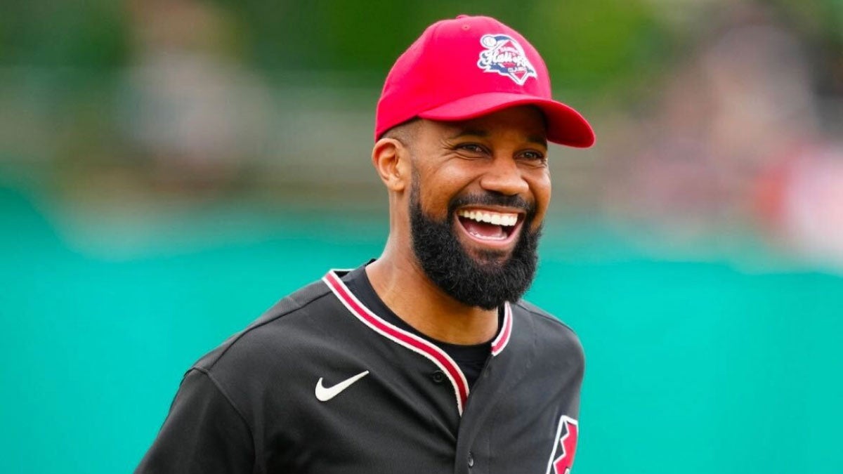 MLB player Chris Young smiles while on the field.